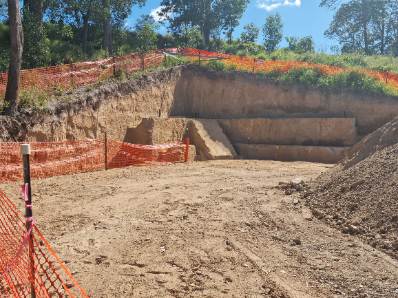 Deep footings excavated with clean vertical walls, ready for formwork